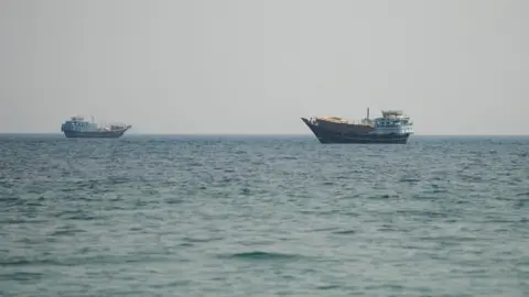 Two vessels in the Strait of Hormuz, as seen from Musandam, Oman. 