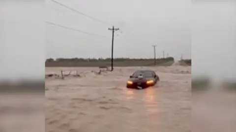 A car is under water in Texas.