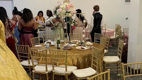 @moreofnita photo of people in evening dresses and dining tables at a casual Bridgerton party in Detroit