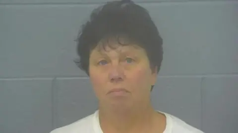 police handout Ms Findley in a mugshot