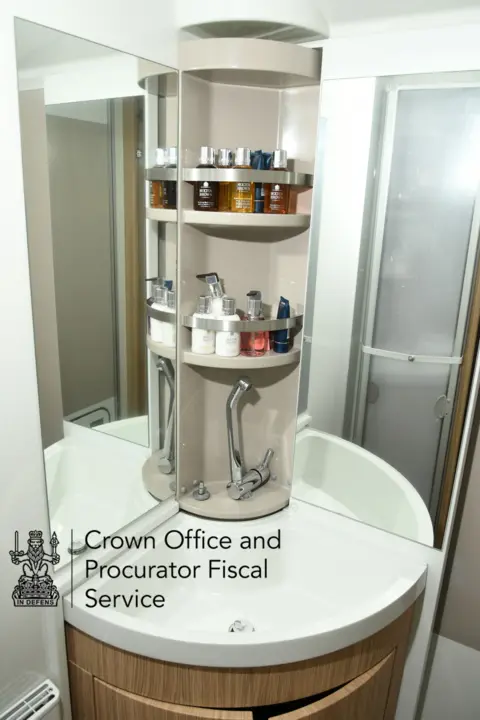 COPFS Small caravan bathroom with built-in shelves and mirrored walls