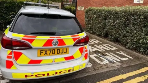 A police car in Frank Swaby Court, Lincoln.