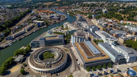 An aerial shot of Bristol city centre showing the Harbourside and Clifton