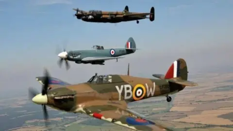 RAF Three World War Two-period planes are flying high above fields