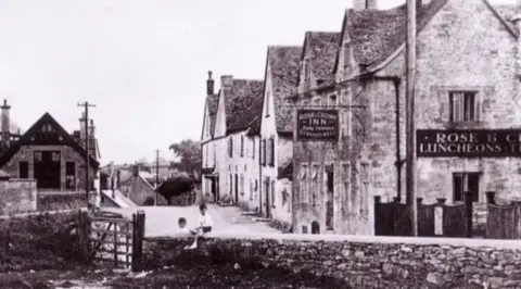 GloucestershirePubs A black and white photo of the Rose and Crown