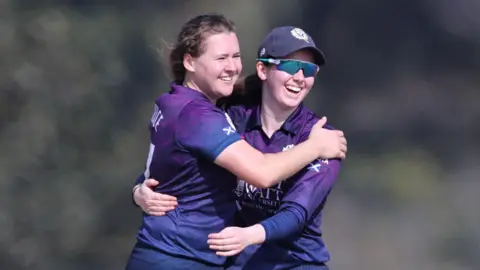 Scotland captain Kathryn Bryce celebrates a wicket with team-mate Katherine Fraser