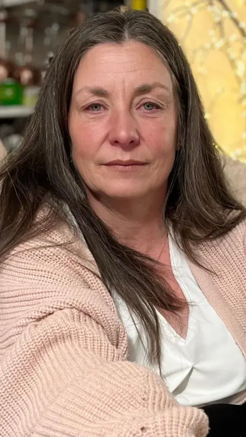 Lady looks at the camera.