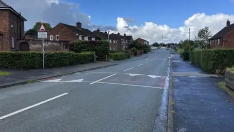 Central Drive in Shotton, Flintshire with the road in the middle and houses on each side.