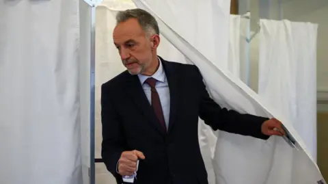 Reuters Emmanuel Grégoire casts his vote 