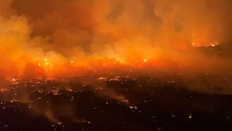 Ronan Dugan An evening picture of flames burning across dry land