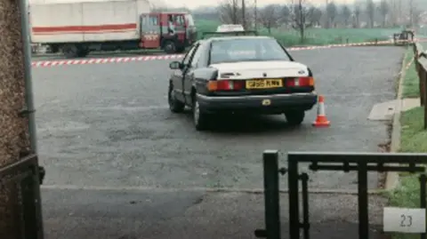 Supplied An archive picture of the crime scene in Gedling. It depicts a police cordon, as well as a taxi