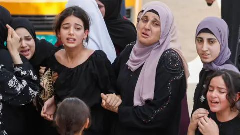 Reuters Women and girls mourn during the ceremonial   of 16-year-old Palestinian Loujain Musleh successful  Kafr Dan, successful  the northbound  of the occupied West Bank (4 September 2024)