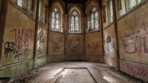 Dan Weatherley The mausoleum covered in graffiti 