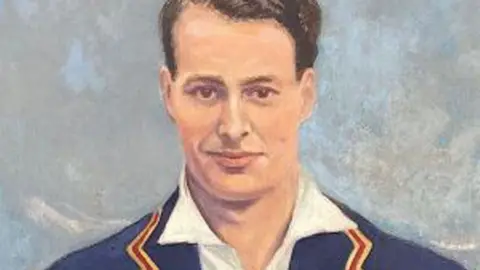 Essex Cricket Club A colourful portrait of Ken Farnes. He has short dark hair and is wearing a blue blazer over a white shirt. Behind him is grey sky.