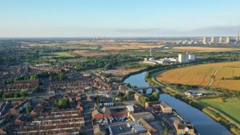 West Lindsey District Council Aerial view of buildings in Gainsborough with the River Trent, which marks the border with Nottinghamshire, in view.