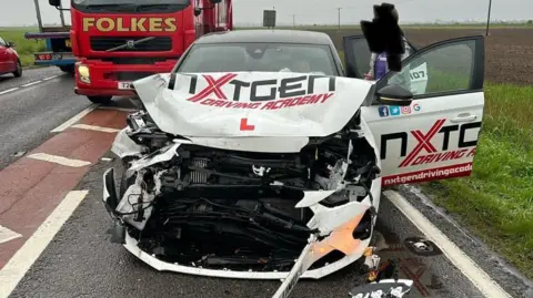 Nxt Gen Car with severe crash damage on road