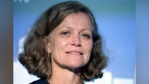 Getty Images A headshot of Emma Howard Boyd who has curly brown hair down to her shoulder