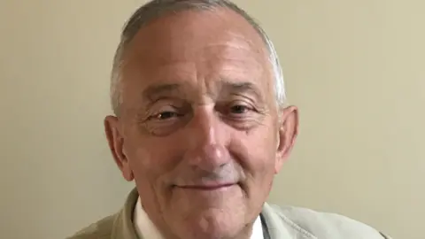 Melton Borough Council A head-and shoulders image of a man with grey hair