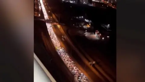 Huge queue of traffic at night on a highway in Tehran