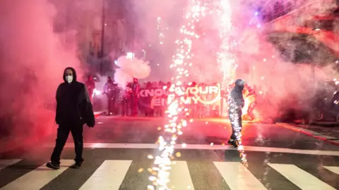 Demonstrators clash with police during a protest against the Milano Cortina 2026 Winter Olympics in Milan, Italy, 07 February
