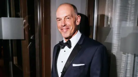 A headshot of TV presenter Phil Spencer.