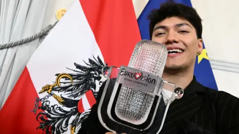 Getty Images JJ holding the Eurovision trophy