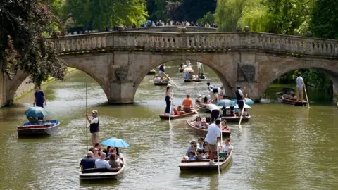 PA Media Punts near a bridge on the River Cam