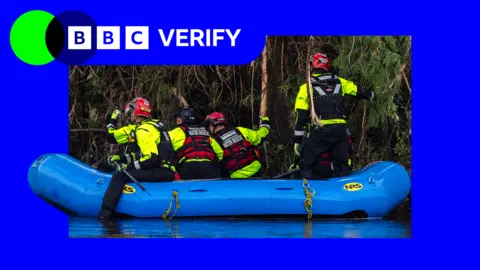 A boat on a river in Texas with four rescue workers on board