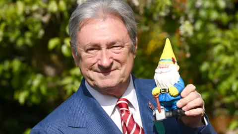 Jeff Spicer/Getty Images Alan Titchmarsh holding the gnome he painted to raise money for the RHS Campaign for School Gardening, at the RHS and The King's Foundation Curious Garden exhibit, during press day at the RHS Chelsea Flower Show, at the Royal Hospital Chelsea in London