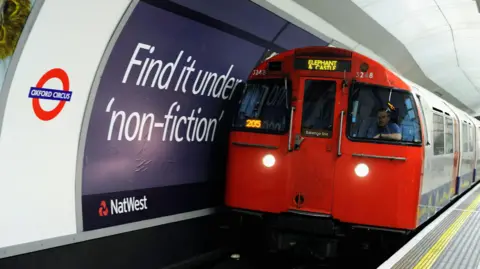 Getty Images Underground train entering Oxford Circus Tube station with driver visible