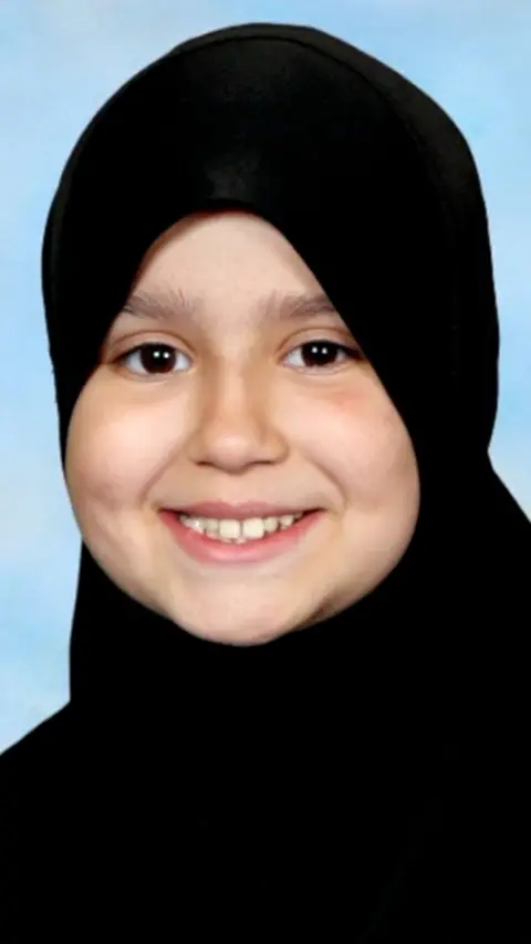 A girl in a black hijab.
