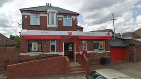 Google Goldthorpe Post Office, a red-brick building with Post Office signage, and a raised entrance with stairs and a ramp.