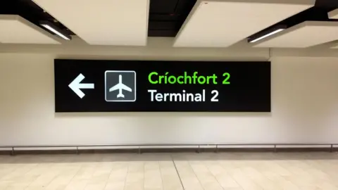 Getty Images Terminal 2 sign at Dublin Airport in both English and Irish. 