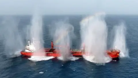 multiple explosions are seen on a red cargo ship blown up by the Houthis 