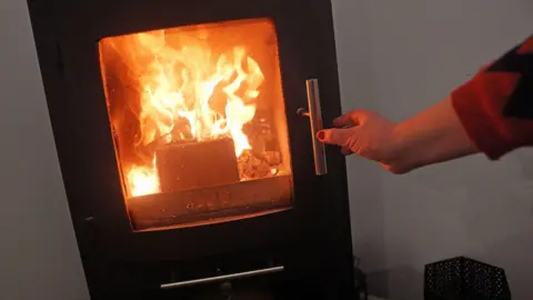 A lit log burner