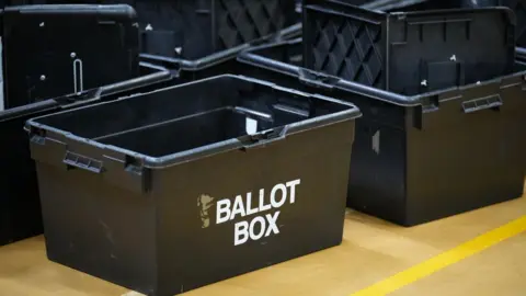 Getty Images Empty ballot boxes sit in a heap.