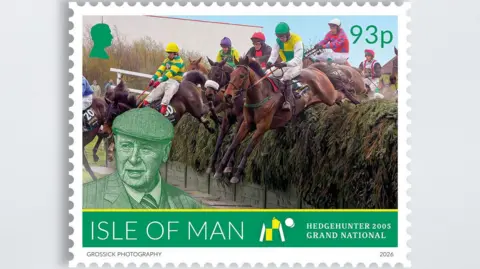 IOMPO A stamp featuring a row of horses jumping a fence at the Grand National at Aintree in 2005. Hedgehunter is in the fore. and there is an illustration of Hemmings on the bottom left corner of the stamp.