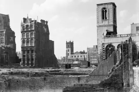 Getty Images Black and white image of ruins in the City of London in 1946 with few buildings standing and the wreckage of St Mary Aldermanbury on the right and St Giles' Cripplegate in the distance