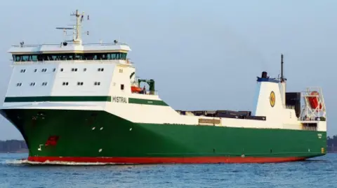 Godby Shipping A long green ship with a white top and the name Mistral on the side. 