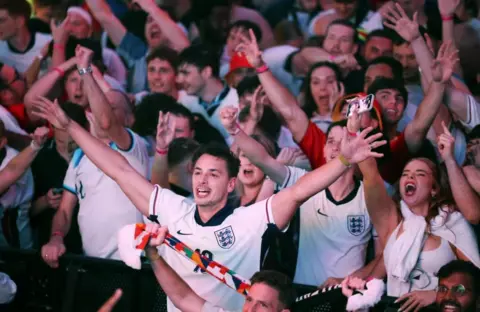 shutterstock England supporters celebrate their team's victory