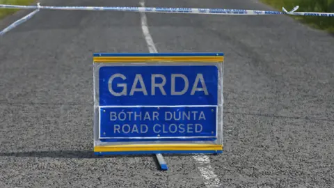 A blue Garda road closed sign