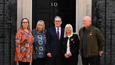 PA Media Sir Keir Starmer greets Charlotte Hennessy, Sue Roberts, Margaret Aspinall (second right) and Steve Kelly, ahead of a meeting with family members of the victims of the Hillsborough disaster, outside 10 Downing Street