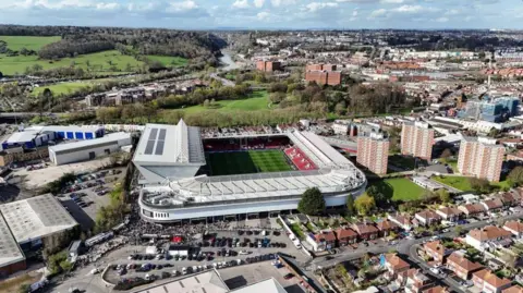 PA Media An aerial shot of Ashton Gate Stadium in Bristol with houses in Clifton in the background