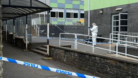 Forensics officer at scene of stabbing in Ysgol Dyffryn Aman