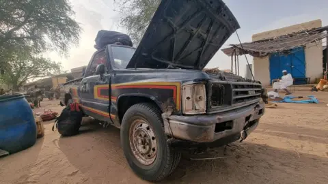 Mohamed Zakaria A vehicle with its bonnet up