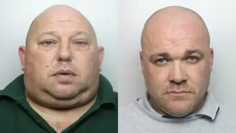 SEROCU Mugshots of Perry Phillips and Gary Worthington, with Phillips on the left. Phillips is wearing a green T-shirt and is bald. Worthington is wearing a grey T-shirt and top. He is also bald. They are both expressionless. 