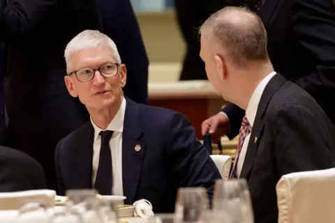 Getty Images Apple CEO Tim Cook attends a state banquet hosted by Chinese President Xi Jinping at the Great Hall of the People on May 14, 2026 in Beijing, China