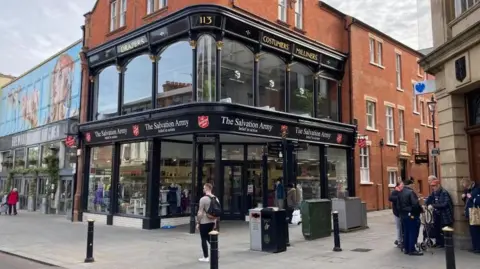 Alex Pope/BBC People walking on Bedford High Street