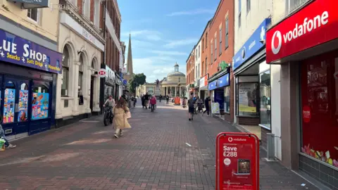 Bridgwater town centre with shops either side of the street