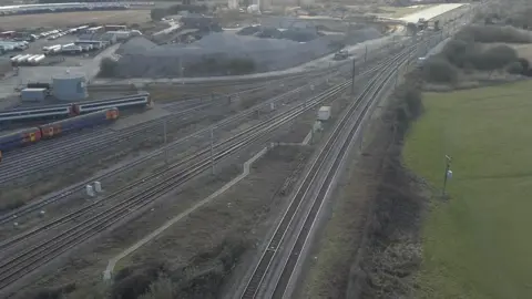Mark Dodd/BBC An aerial view of Ely North junction showing two rail lines converging on the junction
